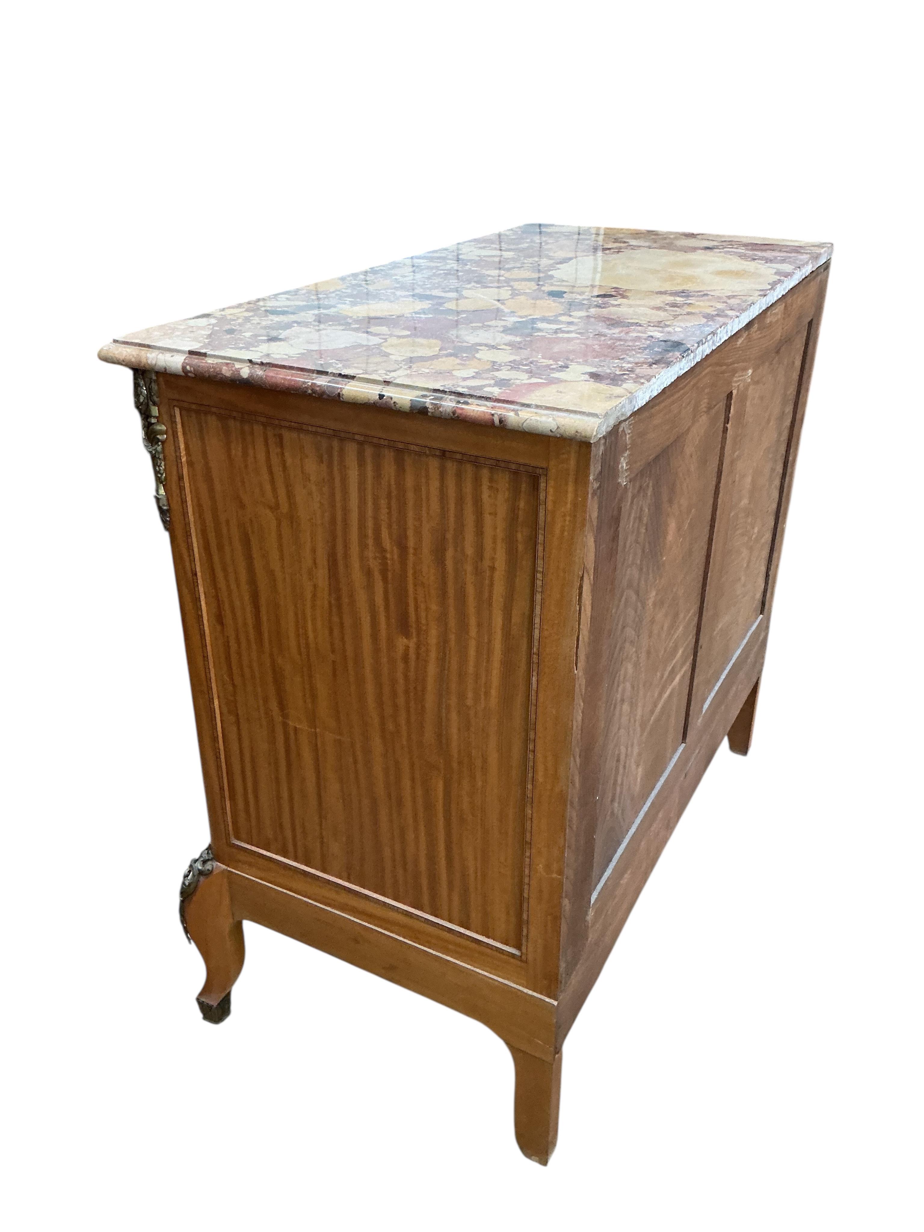 An early 20th century French transition style gilt metal mounted parquetry inlaid marble topped chest, fitted slide, width 99cm, depth 50cm, height 91cm